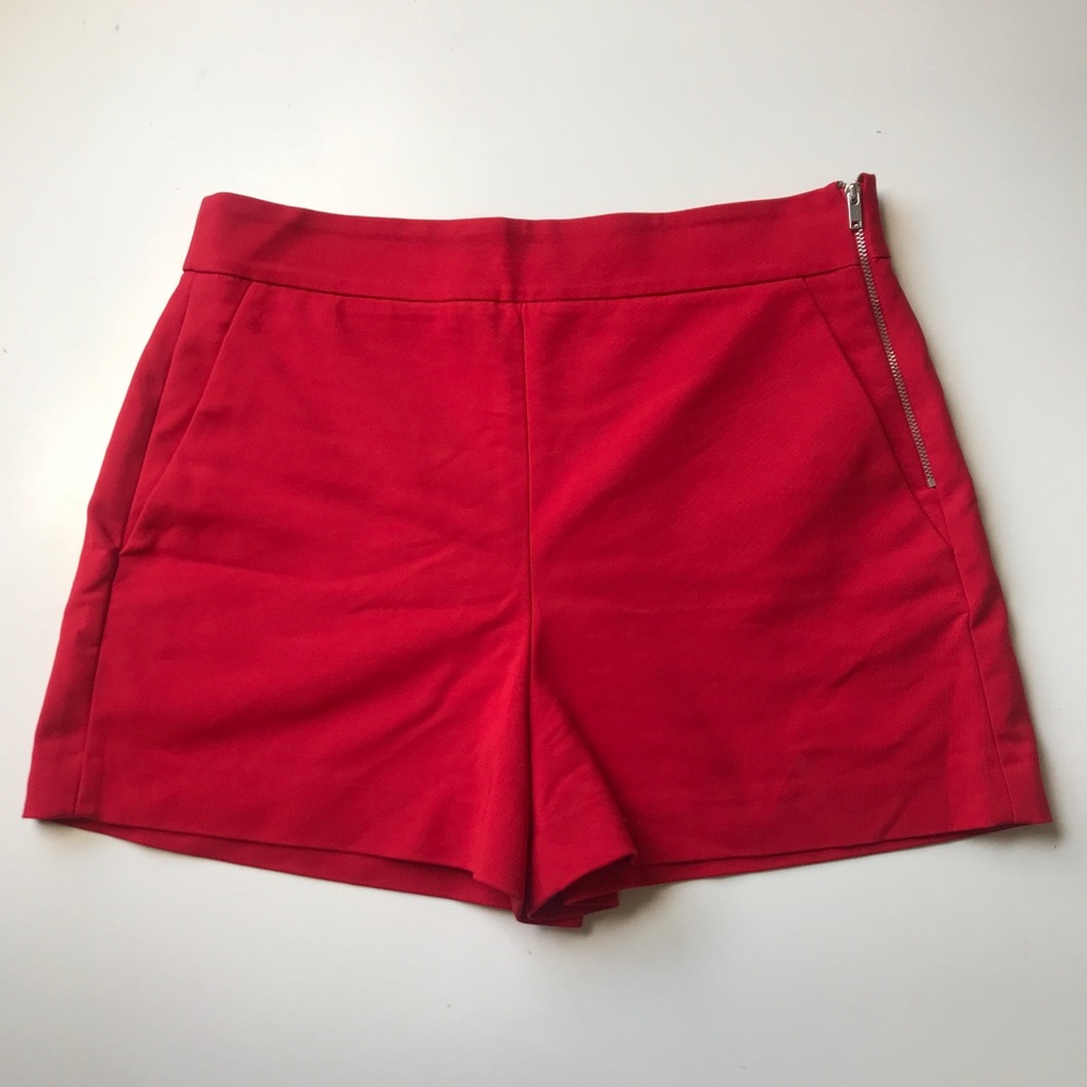 red high-waisted shorts with side zipper